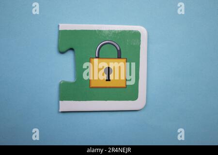 Picture puzzles placed on a blue background. Lock Stock Photo
