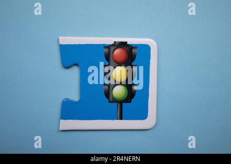 Picture puzzles placed on a blue background. Traffic lights. Stock Photo