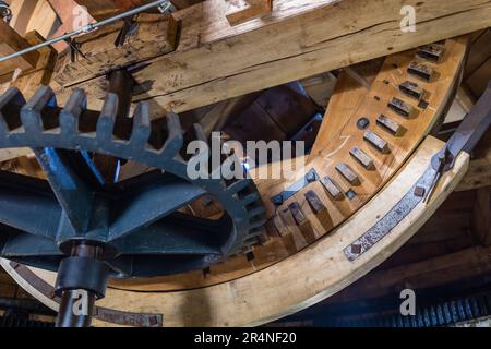 Straupitz, Germany. 29th May, 2023. Various gears mesh together to drive the Holländerwindmühle in the Spreewald town of Straupitz. The Holländerwindmühle in Straupitz is the last working triple windmill in Europe. A grain mill, an oil mill and a sawmill are in operation here. The entire mill complex was renovated in 2001/2002. Credit: Frank Hammerschmidt/dpa/Alamy Live News Stock Photo