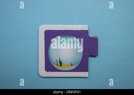 Picture puzzles placed on a blue background. Aquarium Stock Photo