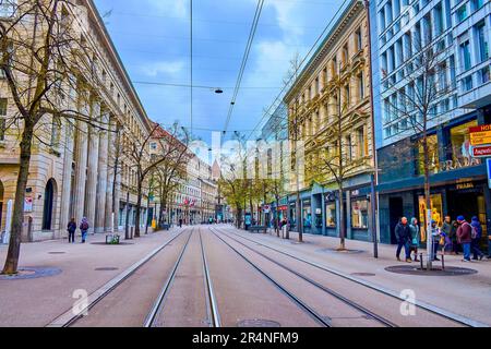 ZURICH, SWITZERLAND - APRIL 3, 2022: Famous Bahnhofstrasse, the main shopping street with luxury boutiques and stores, on April 3 in Zurich, Switzerla Stock Photo