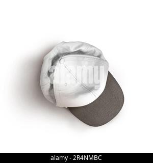 White and black snapback cap mockup on a grey background. Stock Photo