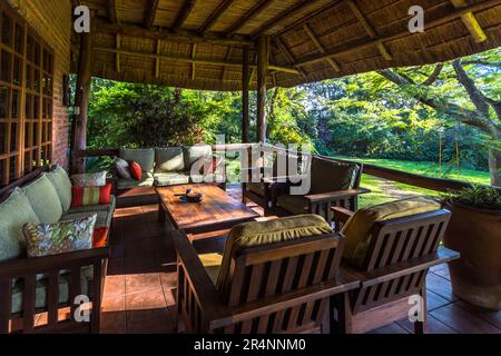 Terrace Kumbali Country Lodge near Lilongwe, Malawi. View into the garden with pool. The property is situated on 650 hectares of agricultural land with maize cultivation and banana plantation. Owned by Guy and Maureen Pickering from South Africa. Stock Photo