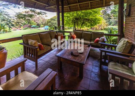 Terrace Kumbali Country Lodge near Lilongwe and view into the garden with pool. The property is situated on 650 hectares of agricultural land with maize cultivation and banana plantation. Owned by Guy and Maureen Pickering from South Africa.. Kumbali Country Lodge in Lilongwe, Malawi Stock Photo