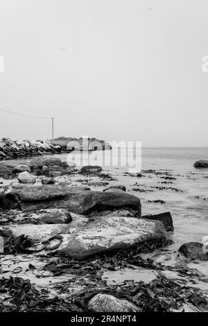 Olberg; Olbergstranden; Raege; Norway; May 20 2023, Black And White Beach Scene With Rocky Outcrops And No People Stock Photo