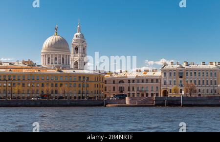 Cityscape of Saint-Petersburg on a sunny summer day. Neva river coastal view, dome of the Church of St. Catherine near Tuchkov Bridge is on a backgrou Stock Photo