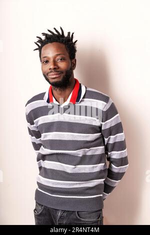 African american man with braids wearing turtleneck sweater excited for ...