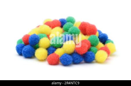 Pile of soft fluffy colorful balls for crafts isolated on white. Stock Photo