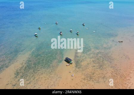 (230529) -- ZHANJIANG, May 29, 2023 (Xinhua) -- This aerial photo taken on May 28, 2023 shows tourists having fun in Jiaowei Township of Xuwen County, Zhanjiang City, south China's Guangdong Province. Bordering the South China Sea on the east and the Beibu Gulf on the west and facing the Hainan Island to the south across the Qiongzhou Strait, Zhanjiang City in south China's Guangdong Province has the largest area of mangrove forest across the country and is an important base of aquatic products. In recent years, the city has put great emphasis on the development of green industries and marine Stock Photo