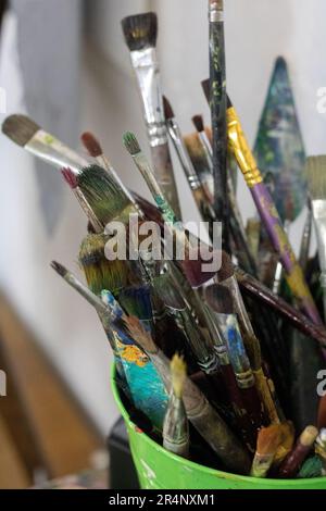 photo of different paint brushes with a glass close-up Stock Photo