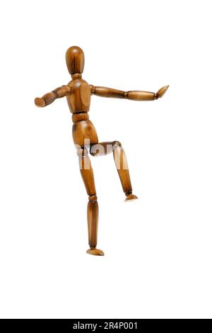 A Wooden Mannequin In A Dance Pose, On It's Stand, On A White Surface.  Stock Photo, Picture and Royalty Free Image. Image 84725373.