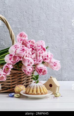 Easter festive table with traditional cake and flower decorations. Festive decor Stock Photo