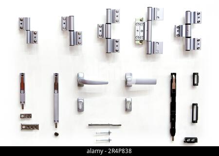 Accessories for doors on bench in shop isolated white Stock Photo