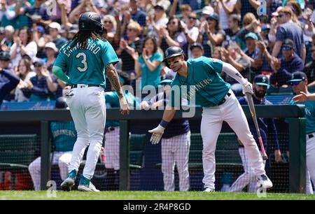 Seattle Mariners' J.P. Crawford (3) is greeted by Ty France after Crawford  scored in the eighth inning of the team's baseball game against the Los  Angeles Angels, Friday, April 30, 2021, in