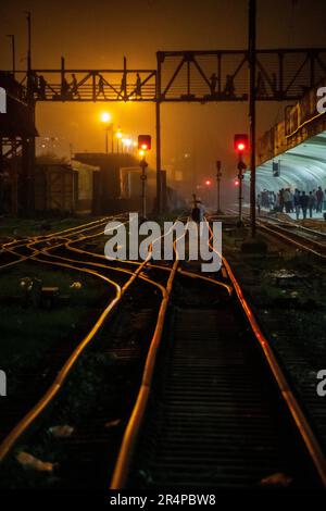 Dhaka Railway Station tracks by night, Dhaka, Bangladesh Stock Photo