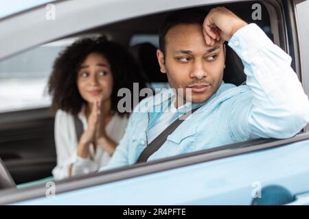 Discontented Husband Sulking At Wife Asking To Buy New Car Stock Photo