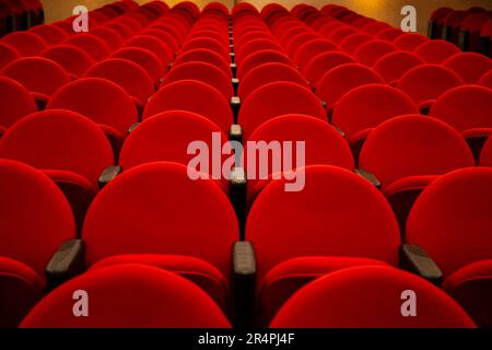Goiania, Goias, Brazil – May 16, 2023: A few rows of red armchairs in an empty theater. Stock Photo