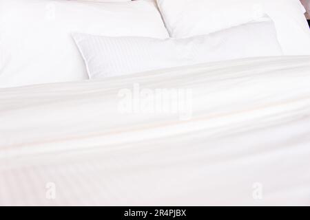 White hotel pillows and bedsheets Stock Photo