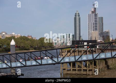 Tourists on the Uber Boat Pier Battersea Power Station Stock Photo