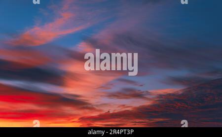 The evening sky. The sunset or sunrise is decorated with clouds in various shapes. Looks beautiful. Stock Photo
