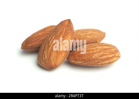 Group of almonds isolated on white. Heap of almond nuts isolated on white background. Stock Photo
