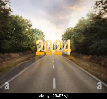 Start of new 2024 year. Asphalt road leading to numbers Stock Photo