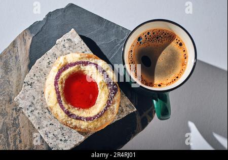 Cup of coffee and topping cream donut Stock Photo