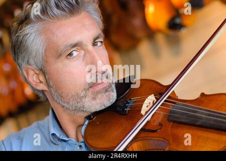 portait of man playing violin Stock Photo