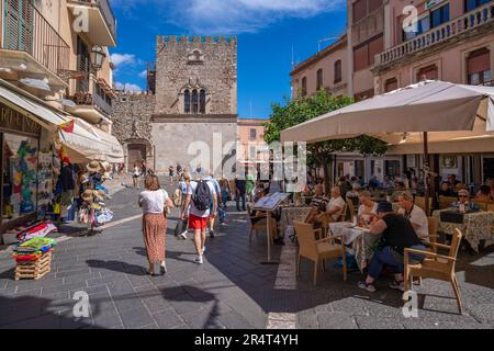 View of Palazzo Corvaja and cafes in Piazza Vittorio Emanuele II in Taormina, Taormina, Sicily, Italy, Europe Stock Photo