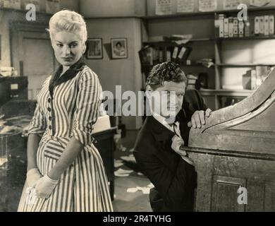 British actress Belinda Lee and actor Benny Hill in the movie Who Done It?, UK 1956 Stock Photo
