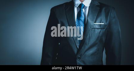 businessman standing on dark gradient background. business concept. suit. Stock Photo