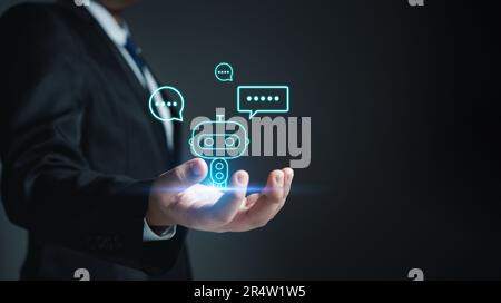 Chatbot. Ai. Robot. Businessman in suit holding a virtual model of artificial Intelligence. Using artificial Intelligence helps to work more efficient Stock Photo