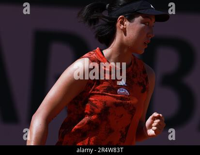 Paris, France. 30th May, 2023. Wang Xinyu reacts during the women's singles first round match between Wang Xinyu of China and Marie Bouzkova of the Czech Republic at the French Open tennis tournament at Roland Garros in Paris, France, May 30, 2023. Credit: Gao Jing/Xinhua/Alamy Live News Stock Photo