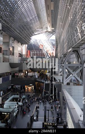 Kyoto, Japan. 7th Mar, 2023. Businessmen, commuters, tourists and visitors alike pass through Kyoto Station.Kyoto Station (äº¬éƒ½é§…) is operated by West Japan Railway Company (JR West) and serves as a major hub for rail travel in Kansai. The station is well-connected, offering a wide range of train services, including the high-speed rail Shinkansen bullet trains, local and express trains, as well as the JR Sagano Line and Kintetsu Kyoto Line. It provides convenient access to various destinations within Kyoto prefecture and beyond. The building was designed by architect Hiroshi Hara.Kyoto Stock Photo