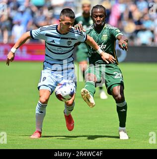 Kansas City, USA. 28th May, 2023. Sporting Kansas City midfielder Erik Thommy (26, left) and Portland Timbers midfielder Diego Chará (21) vie for the ball. Sporting KC defeated the Portland Timbers in a Major League Soccer game on May 28, 2023 at Children's Mercy Park Stadium in Kansas City, KS, USA. Photo by Tim Vizer/Sipa USA Credit: Sipa USA/Alamy Live News Stock Photo