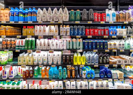 Italy - May 25, 2023: packs of shampoo and shower foam of different brands displayed for sale on Italian supermarket shelf. Cosmetics and body care pr Stock Photo