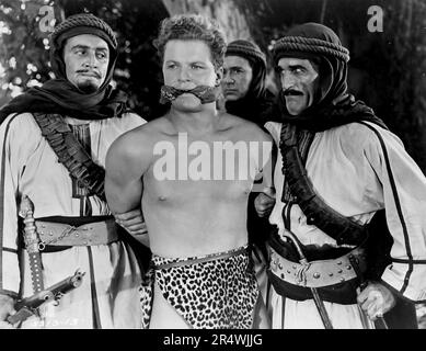 Bomba the Jungle Boy is a 1949 film about a father and daughter who discover a child who lives in the jungle. Starring Johnny Sheffield, Peggy Ann Garner and Onslow Stevens. Stock Photo