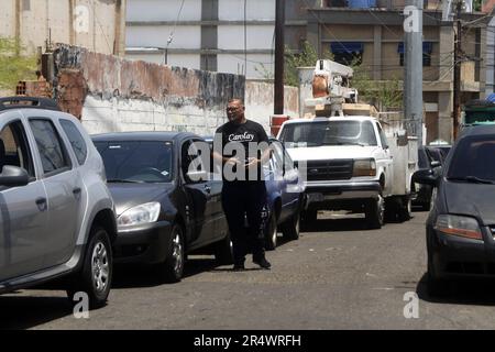 Venezuelans get up early and line up in long lines, for eight and 12 hours this Sunday, May 28, to be able to fill their vehicles with gasoline, in the city of Maracaibo, Venezuela. The queues are due to the shortage of fuel, generated by failures in the distribution to the service stations, and which exceed two kilometers of cars. Until waiting for the arrival of the tanker trucks, from the state-owned Petróleos de Venezuela (PDVSA) with the dispatch. The arrival of the fuel at the gas stations does not have a fixed time or date, since the distribution depends on the arrival of the ships. To Stock Photo