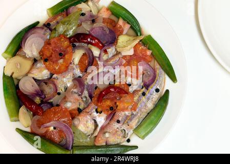 Paksiw na bisugo. Threadfin bream cooked and simmered in vinegar - a Filipino dish. Stock Photo