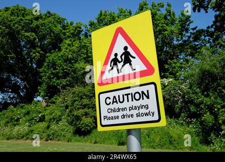 caution children playing road sign outside park, norfolk, england Stock Photo