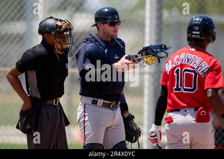 Umpire Sam Glickman and Boston Red Sox catcher Brooks Brannon (17