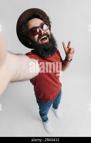 Handsome bearded man taking selfie Stock Photo