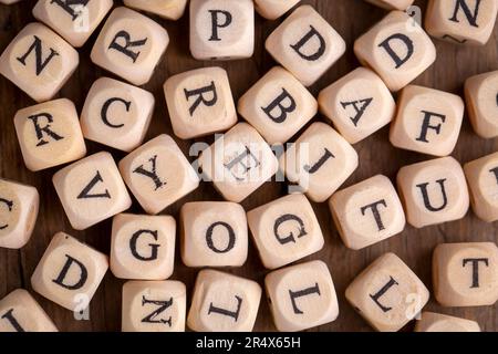Random sorted wooden alphabet letters Stock Photo