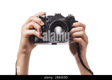 Camera in hands isolated on white background Stock Photo