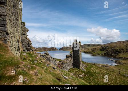 The ruins of Three Castle Head, Dunlough, with scenic view of the surrounding hills and countryside of Mizen Peninsula; West Cork, Ireland Stock Photo