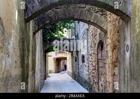 SOMMIERES, FRANCE - JULY 14th, 2018: View of a paved street in Sommières, Occitanie, South of France Stock Photo