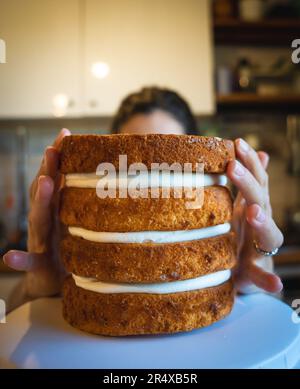 Pastry Chef - Experience Cake-Making Mastery: Witness a Woman's Culinary Artistry Unfold in Every Whisk, Mix, and Decorative Detail. Stock Photo