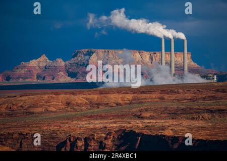 Steam billows from chimneys of the Navajo Power Plant, Arizona, USA; Glen Canyon, Page, Arizona, United States of America Stock Photo