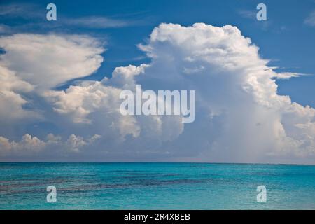 Turquoise blue water in the Seychelles Islands with cloud formations in the sky; Seychelles Stock Photo