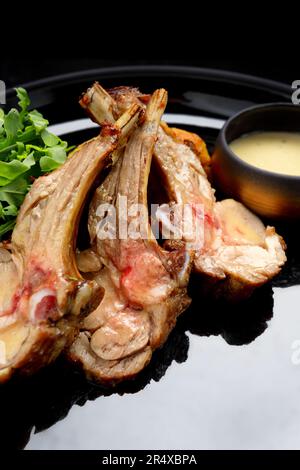 grilled ribs with vegetable salad and sauce Stock Photo